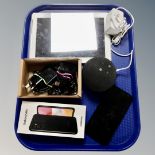 A tray containing a Samsung tablet and mobile phone together with an Amazon speaker.