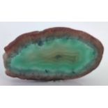 An agate green slice measuring approximately 1.75" across.
