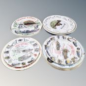 An assortment of 13 commemorative china plates.