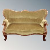 A 19th century mahogany serpentine settee in dralon fabric on scroll feet