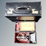 A vintage C Baker of London electric microscope in fitted box together with a leather combination
