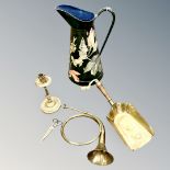 An engraved brass candlestick, horn, coal shovel,
