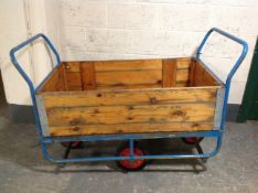 A Slingsby metal framed pine porter's trolley.