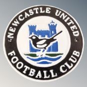 A cast iron wall plaque, Newcastle United club crest.