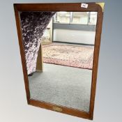 A mahogany mirror with brass corners,