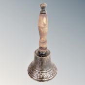 A cast iron hand bell.