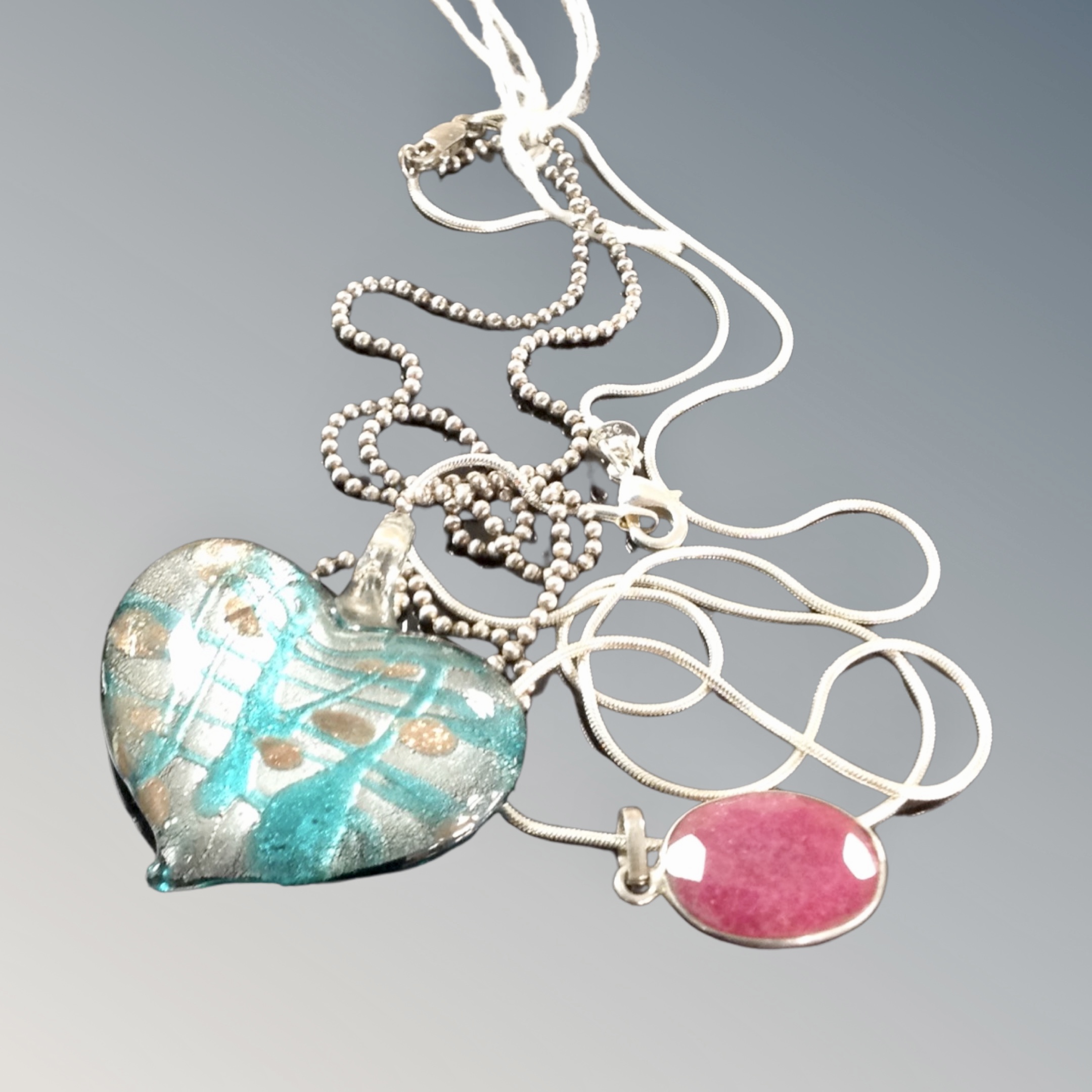 A Murano glass heart pendant on marked beaded silver together with a sterling silver snake chain