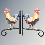 A pair of cast iron cockerel wall brackets.