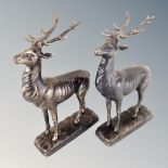 A pair of cast iron stag figures.