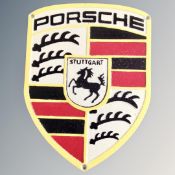 A cast iron wall plaque, Porsche.