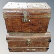 Two antique tin trunks.