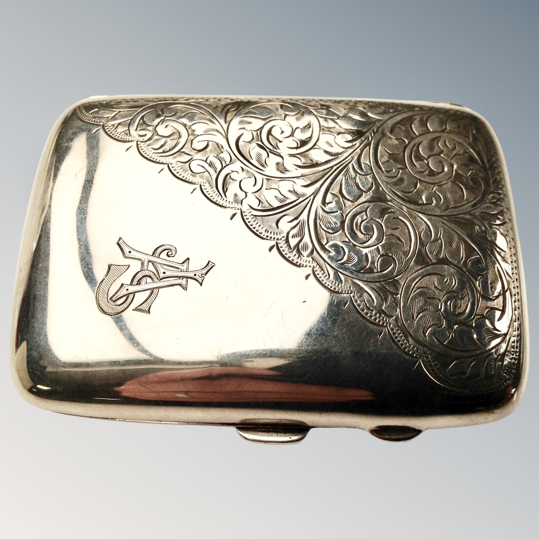 A silver cigarette case.