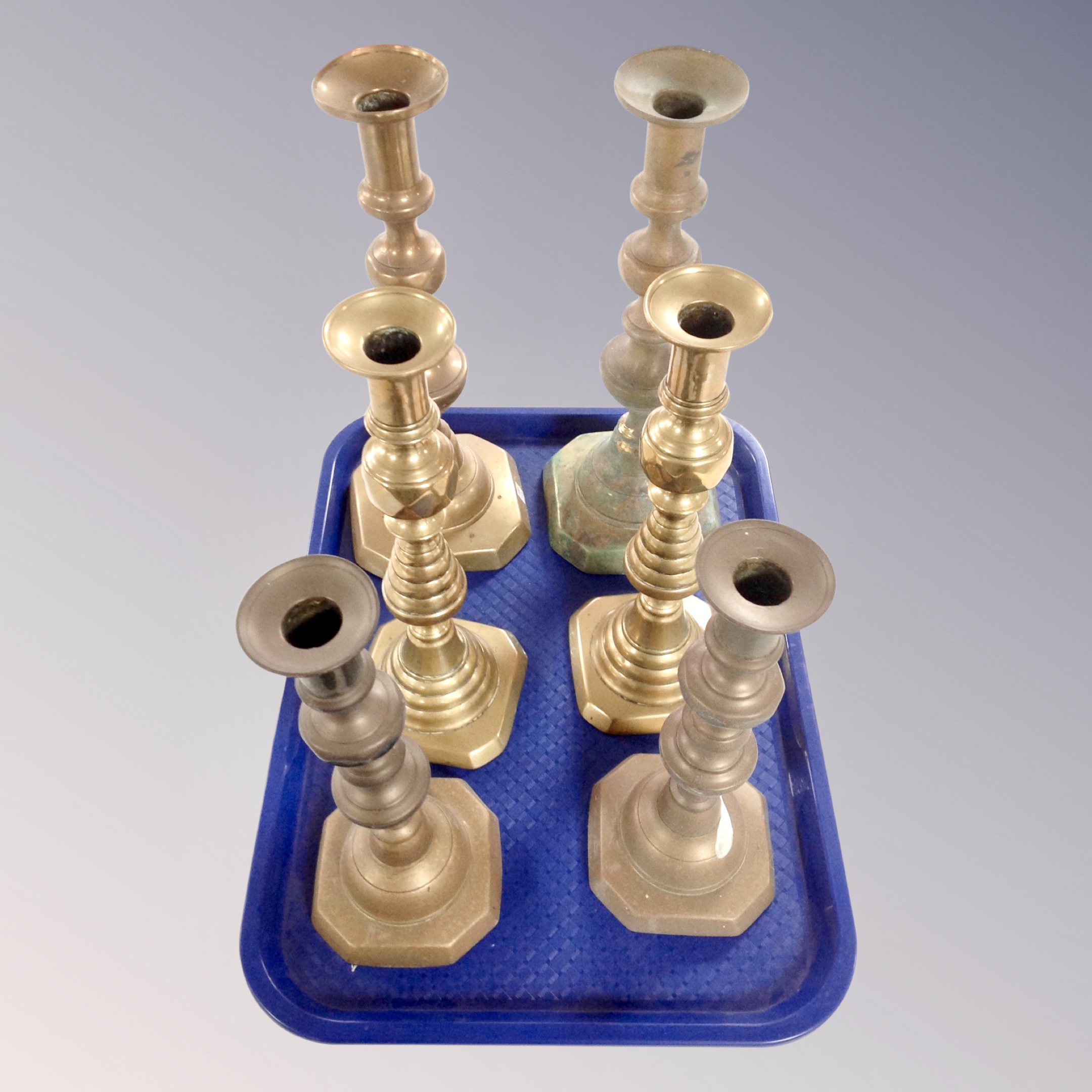 Three pairs of 19th century brass candlesticks.