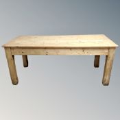 An early 20th century pine kitchen table