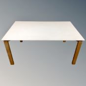 A contemporary dining table on pine legs