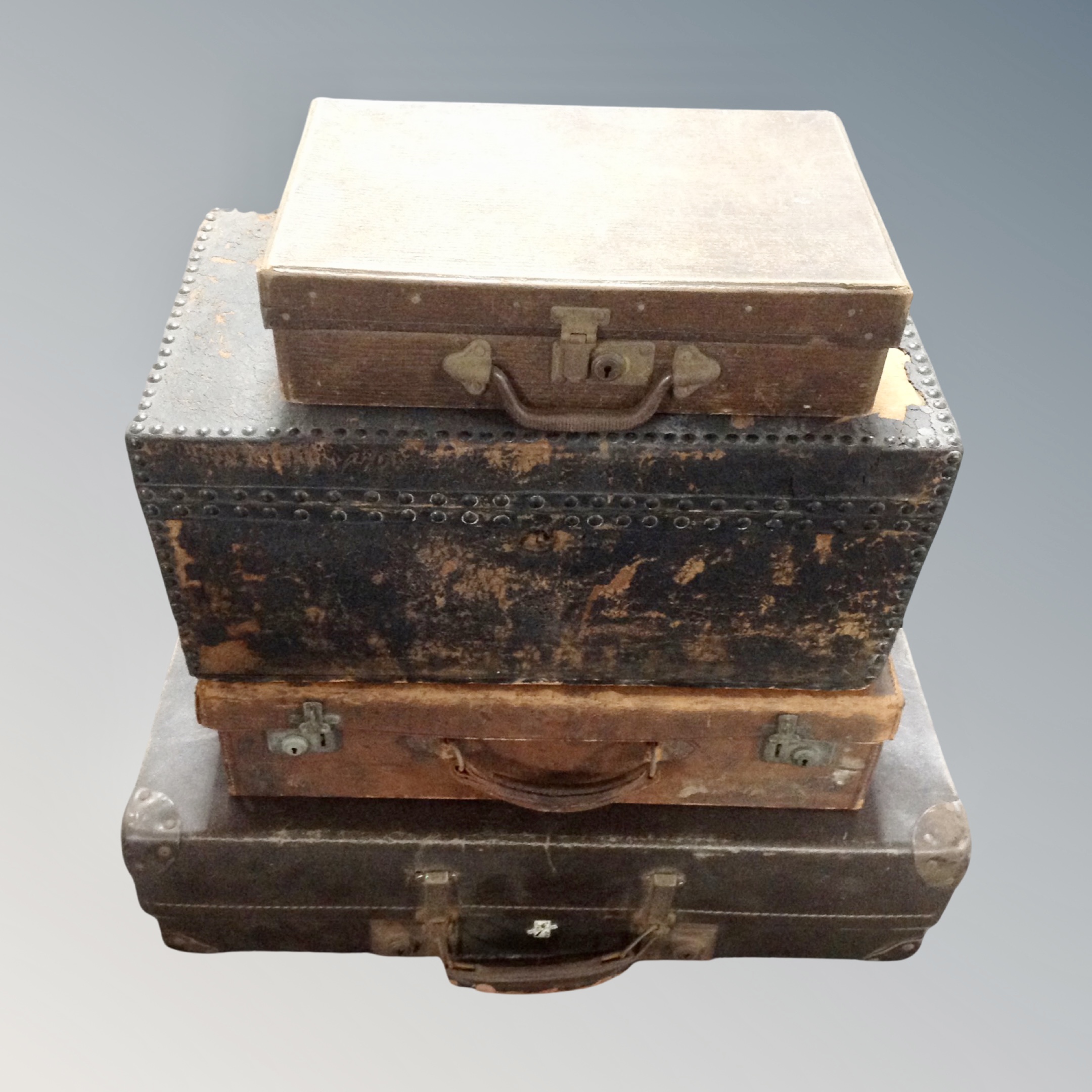 Three 20th century vintage suitcases together with a 19th century box upholstered in leather