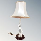 A Guiseppe Armani figural table lamp with shade in the form of an Art Deco lady with dove in hand