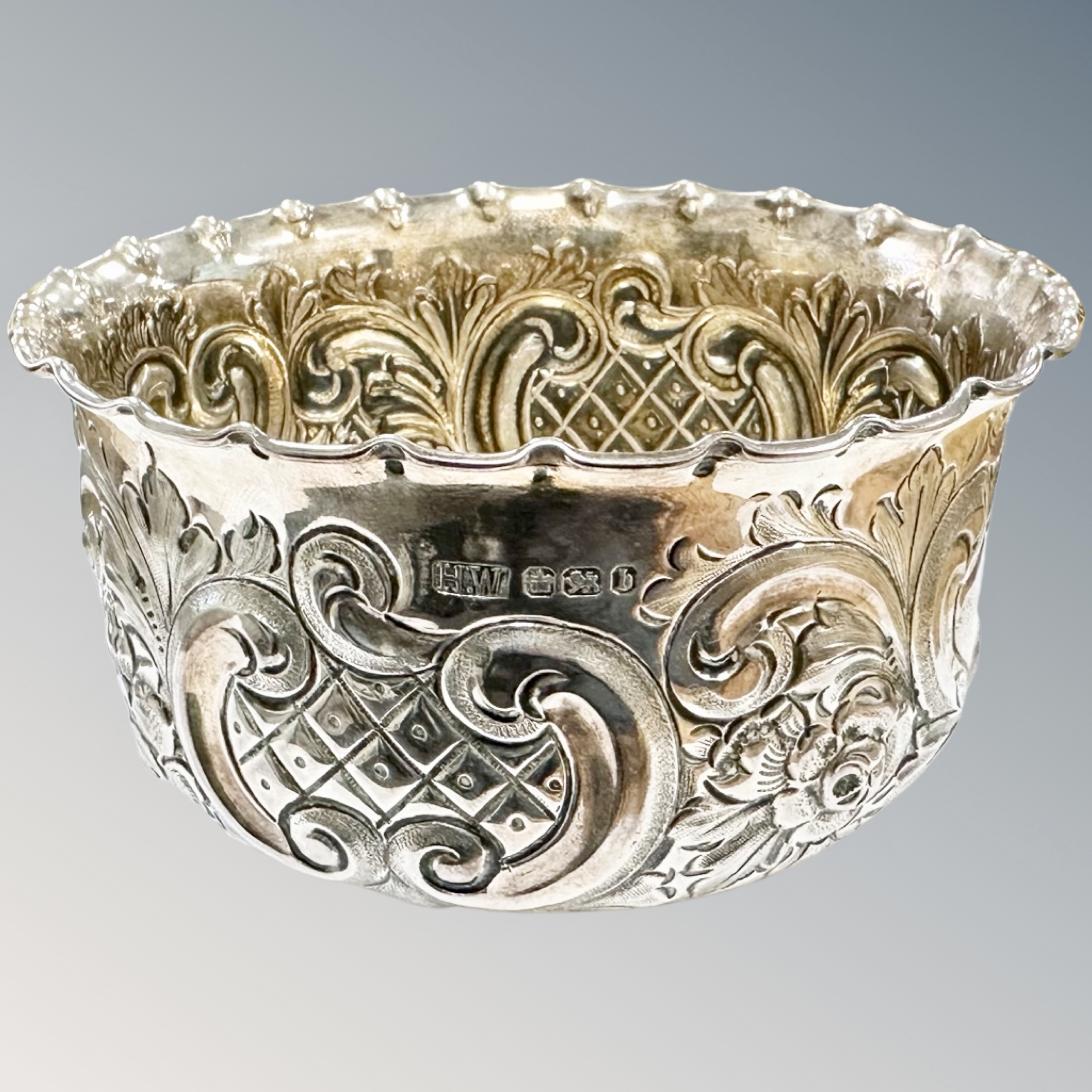 An embossed silver bowl, Sheffield marks, diameter 11cm. CONDITION REPORT: 113.