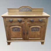 An oak Arts and Crafts double door sideboard