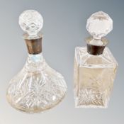 Two cut glass crystal decanters with silver collars