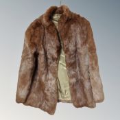 A vintage brown fur coat