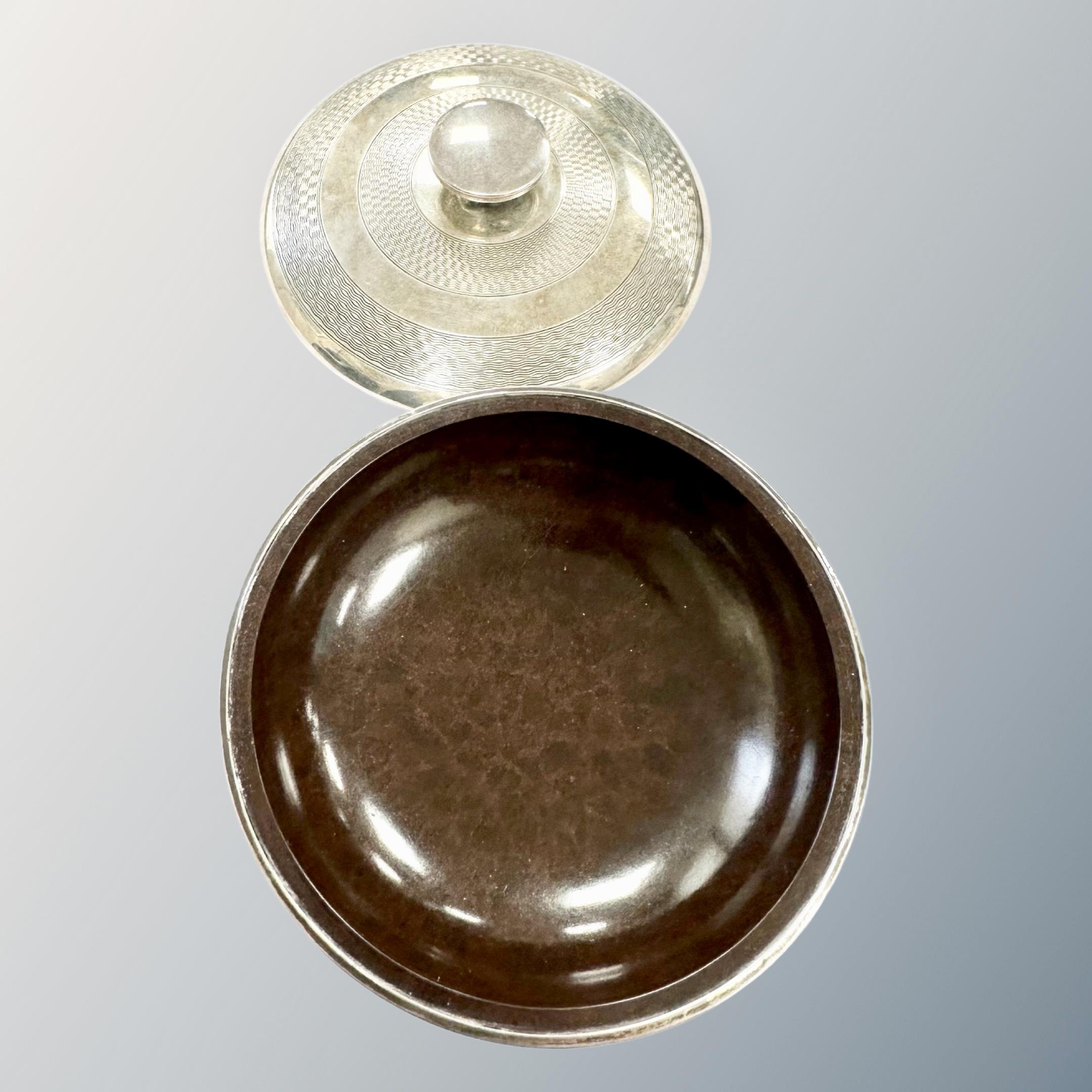 A silver and Bakelite-lined circular lidded dish, Birmingham marks, diameter 11cm. - Image 2 of 2