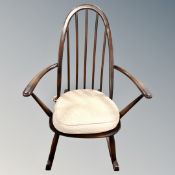 An Ercol elm and beech child's rocking chair
