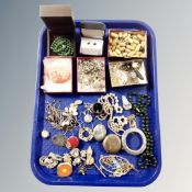 A tray of vintage costume jewellery, cuff links, cameo shell, silver lockets,