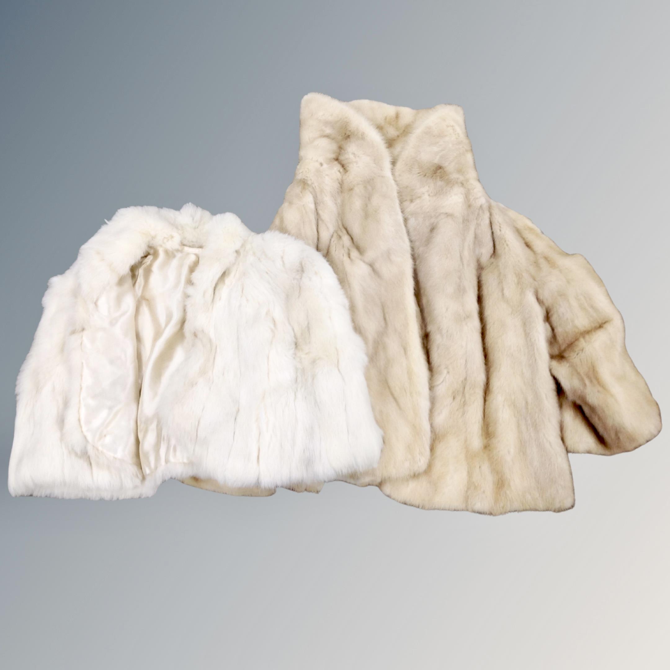 A mink fur wrap together with a fur coat (Af)