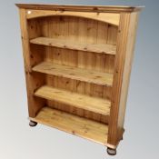 A set of pine bookshelves on bun feet together with further pine 'Herbs and Spices' wall rack