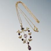 An Edwardian 9ct gold amethyst and seed pearl pendant on chain, pendant 38mm long.