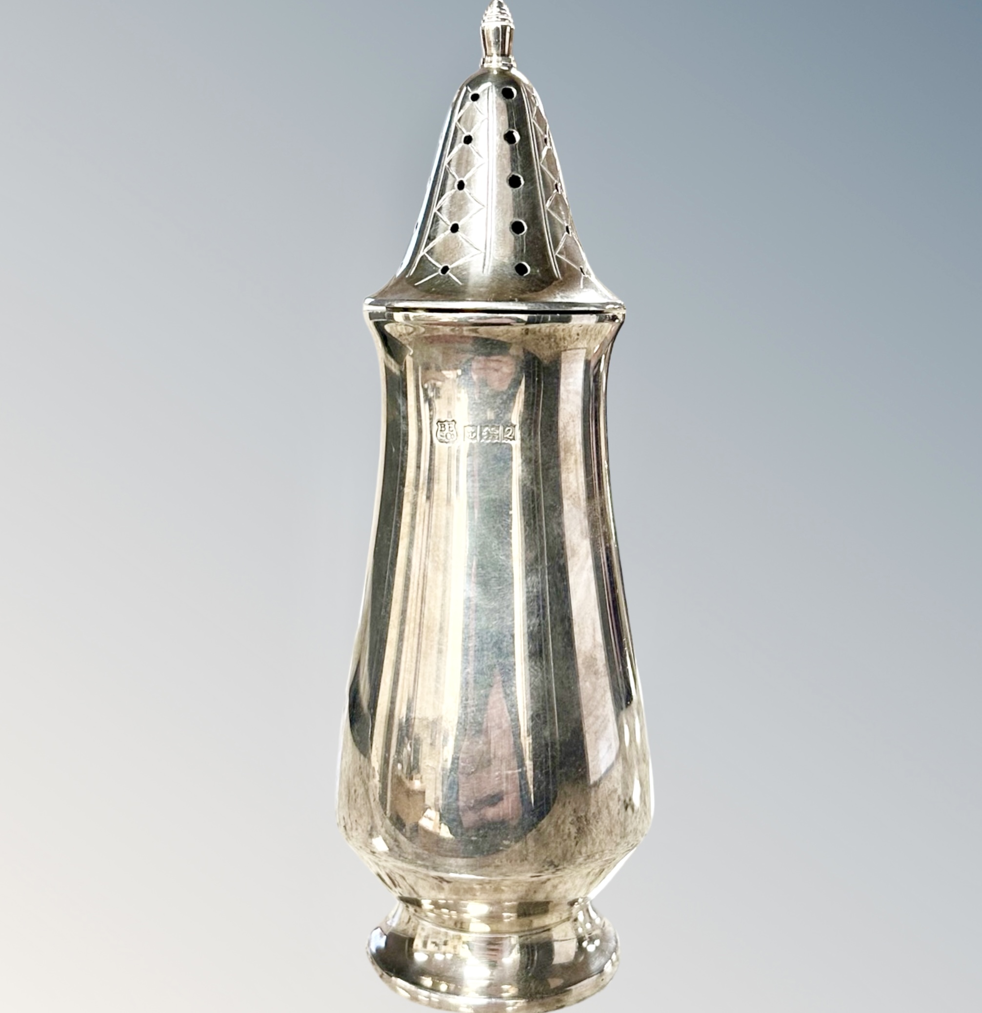 A silver castor, Birmingham marks, height 16.5cm.