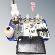 An antique five-piece cruet set on plated stand with cranberry glass flute, pewter pen tray,