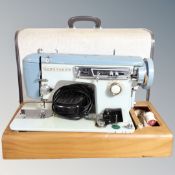 A 20th century Brother electric sewing machine in case