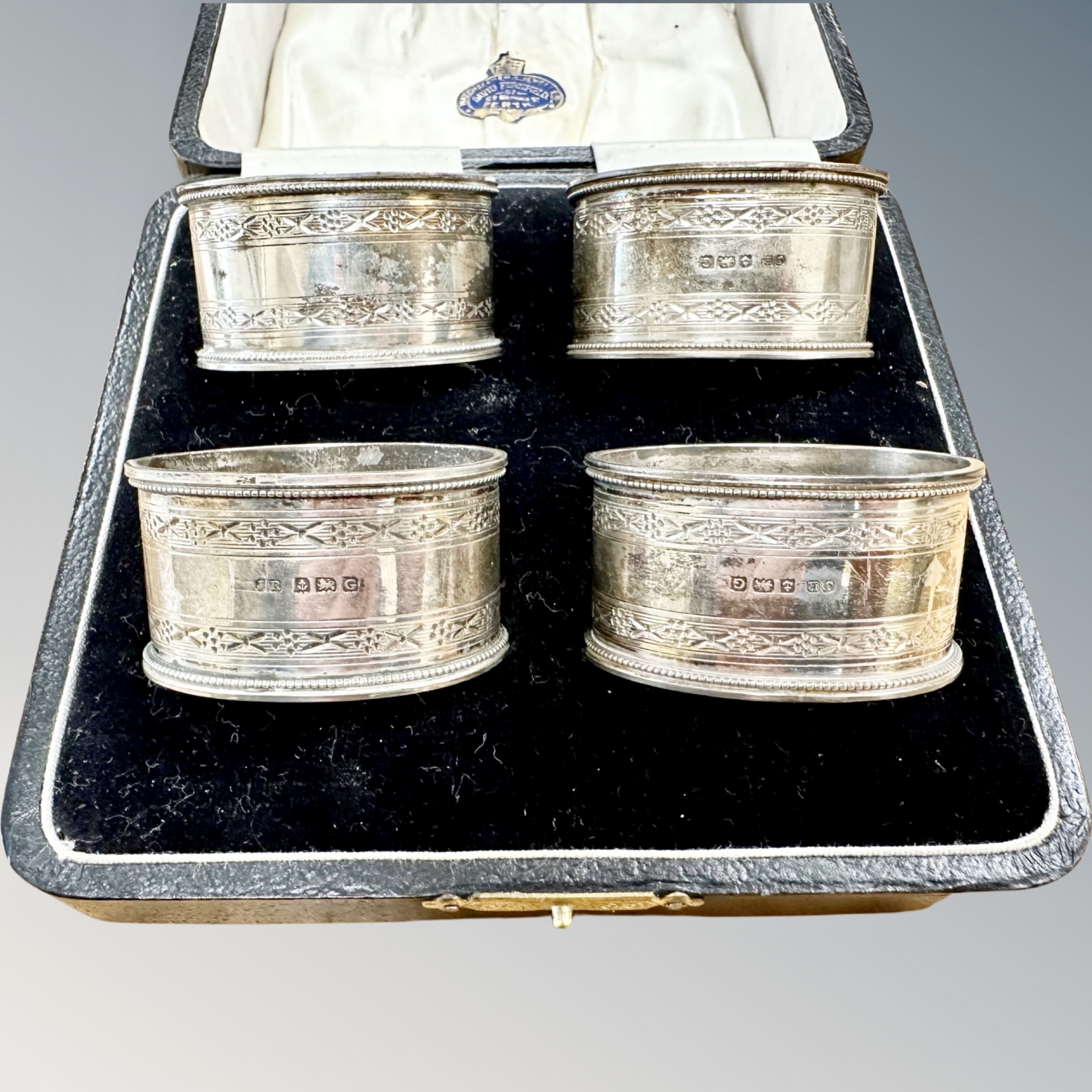 A boxed set of four silver napkin rings, Birmingham marks. CONDITION REPORT: 79. - Image 2 of 2