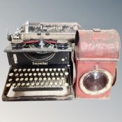 A vintage Imperial typewriter together with a signal railway lamp
