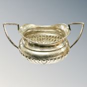 A silver twin-handled sugar pot, Birmingham marks, width 15cm.