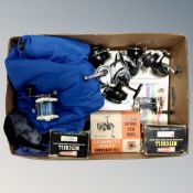 A box containing fishing waterproofs, Abu Garcia Mitchel model 602P reel, boxed and 600P reel boxed,