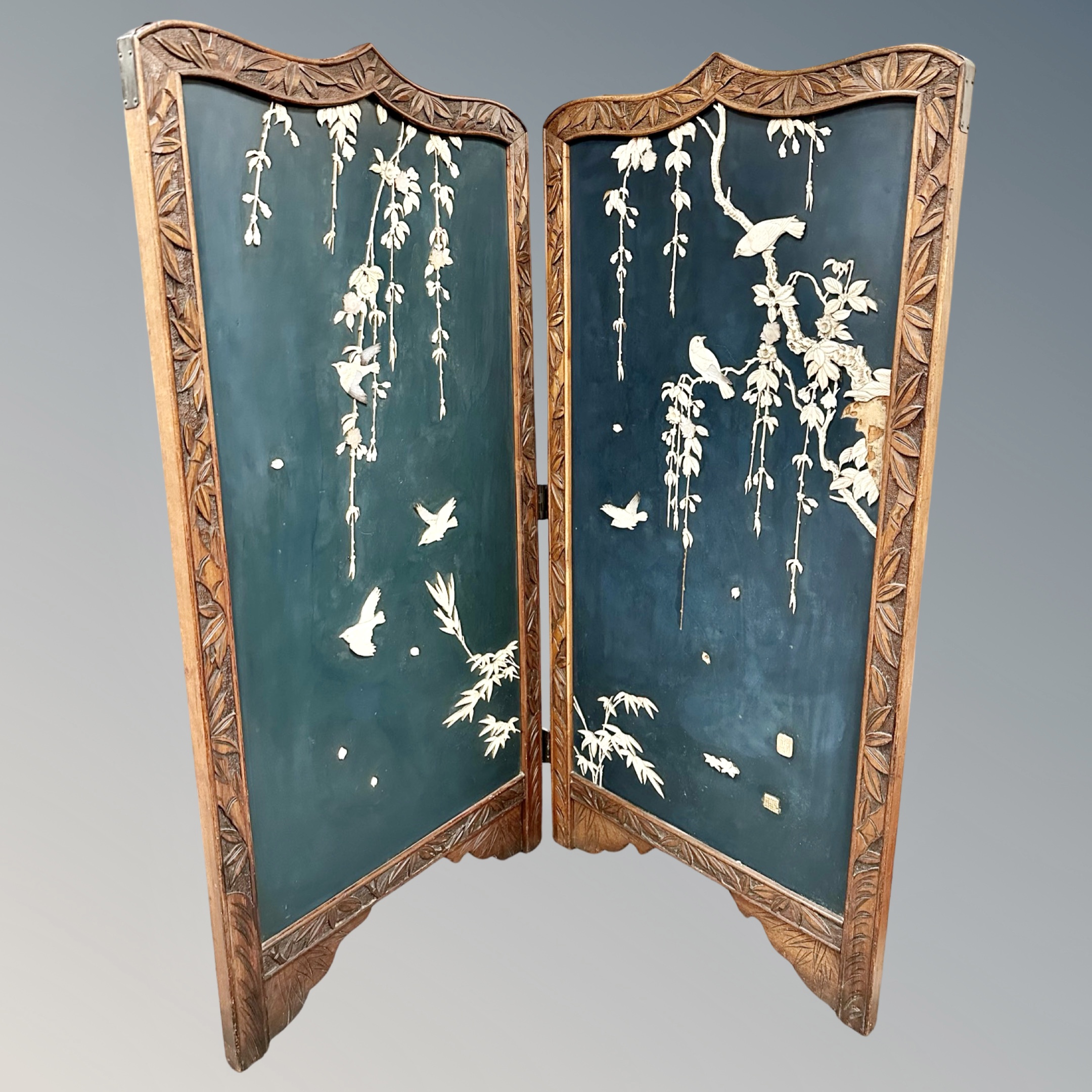 A Japanese Meiji period two-fold screen with Shibayama decoration,