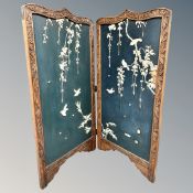 A Japanese Meiji period two-fold screen with Shibayama decoration,