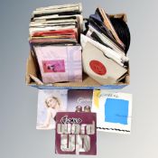 A box of 20th century vinyl 7 inch singles to include The Beatles, Rolling Stones, Roxy music,
