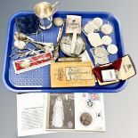 A tray containing crowns including one in silver mount, loose cutlery plated Christening mug,