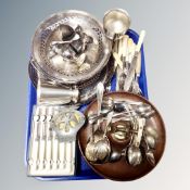 A tray of ship's wheel nut cracker bowl, assorted plated wares, cutlery,