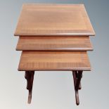 A nest of three 20th century G-Plan tables in a mahogany finish