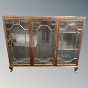 An Edwardian mahogany triple door display cabinet