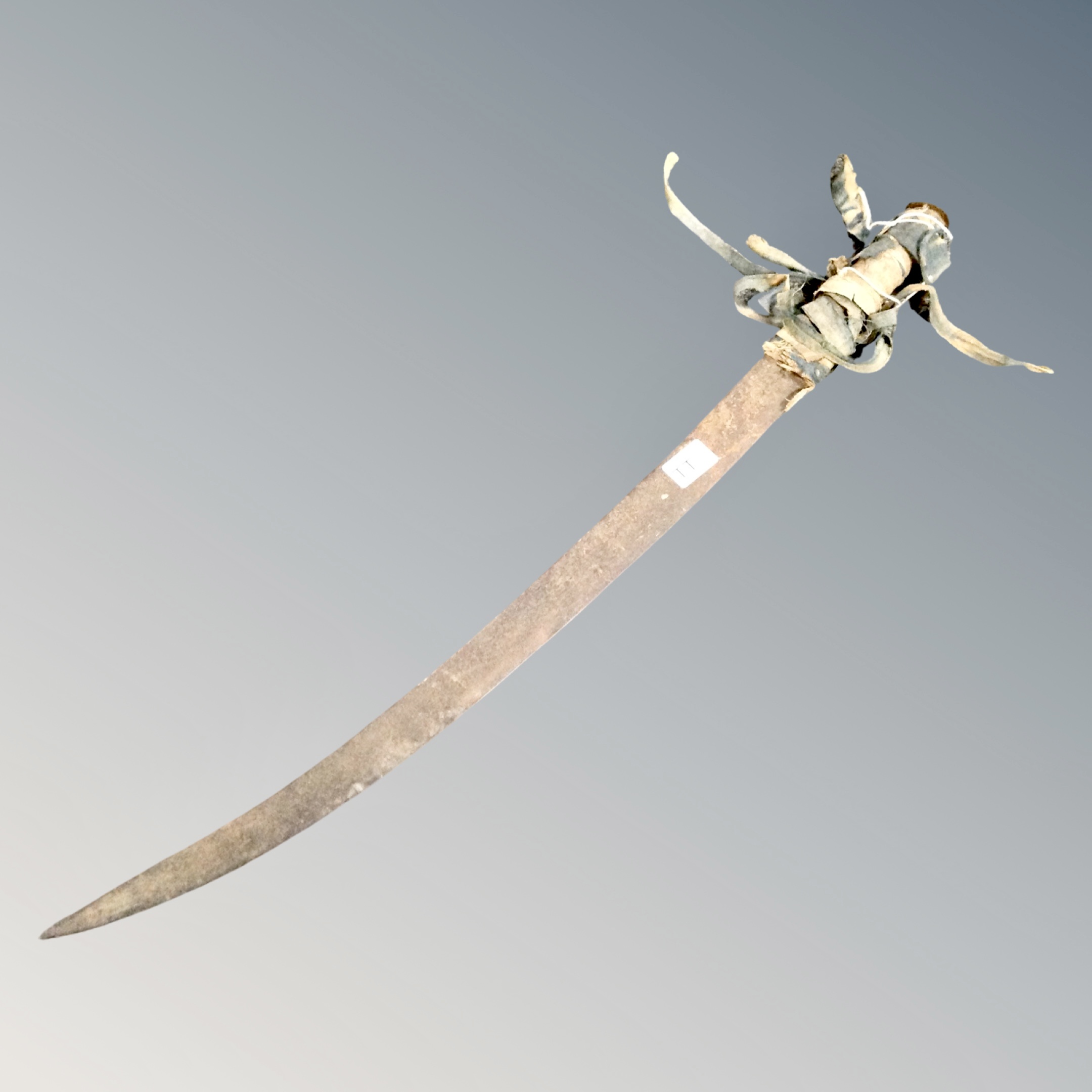 An antique curved sword.