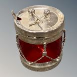 An interesting silver plated preserve pot modelled as a marching drum with batons to the lid,