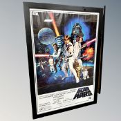 A framed movie poster : Star Wars, 68 cm x 98 cm CONDITION REPORT: Reproduction.
