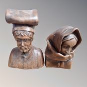 A pair of pottery bust figures of a man & woman,