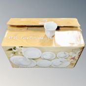 A forty-seven piece white porcelain dinner service, boxed.